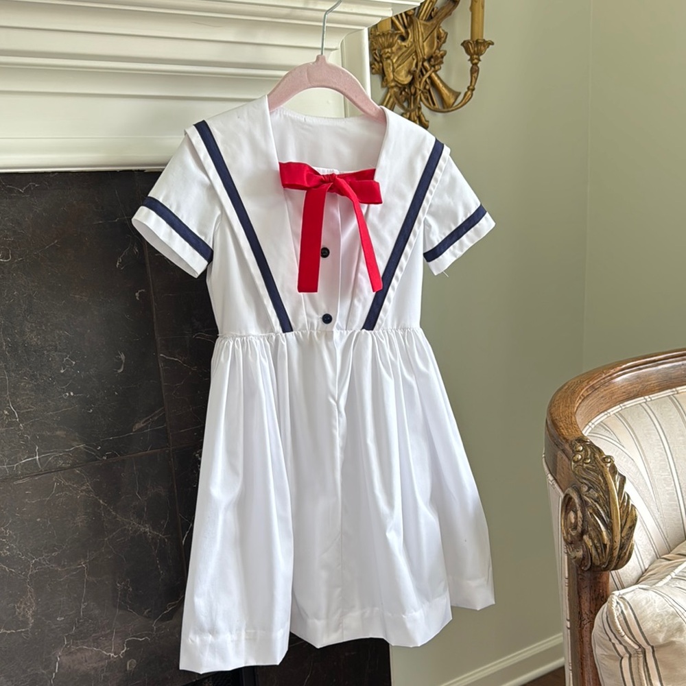 White Dress with Red Bow and Navy Accents